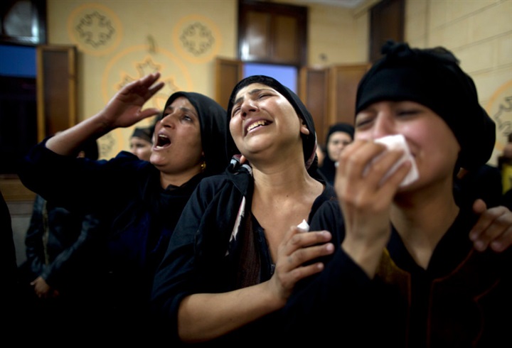 Relatives mourn the