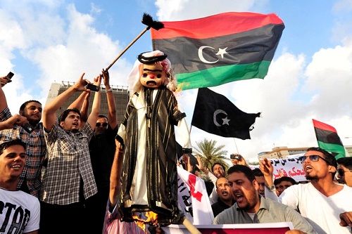 Protesters burn an
